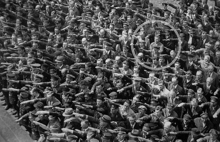 20 Rare Historic Photos That You Probably Haven't Seen Before - A Lone Man Refusing To Do The Nazi Salute, 1936