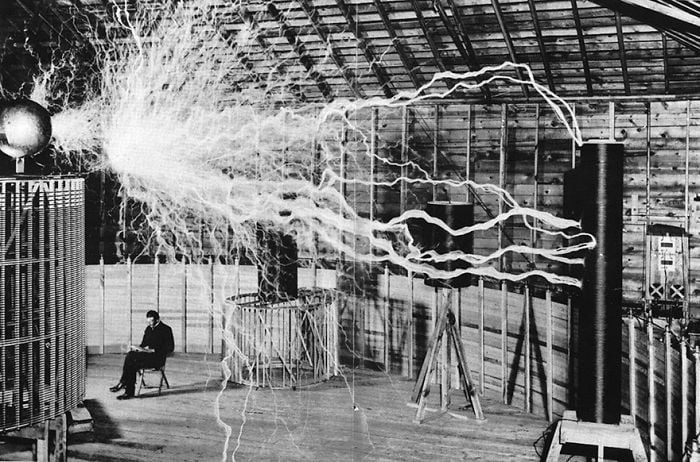 20 Rare Historic Photos That You Probably Haven't Seen Before - Nikola Tesla Sitting In His Laboratory With His “Magnifying Transmitter”