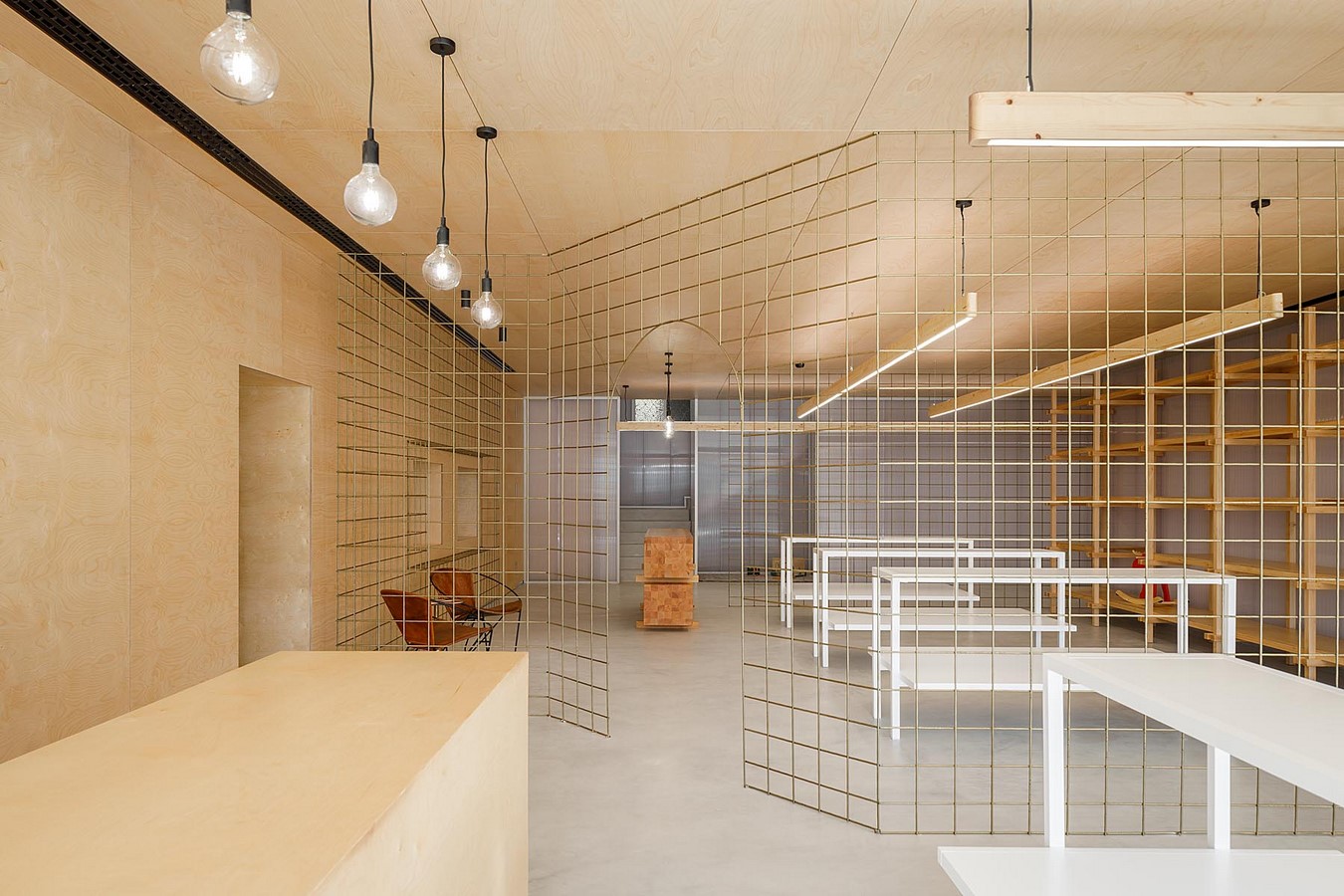 Interior Space divided with Golden Wire Meshes For Multiple Uses In This Store In Portugal by Stu.Dere- Sheet2