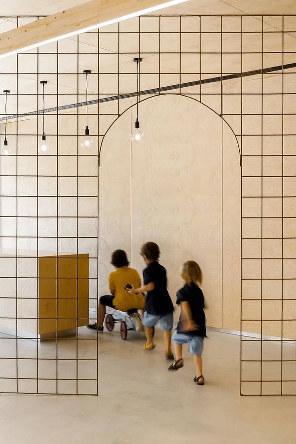 Interior Space divided with Golden Wire Meshes For Multiple Uses In This Store In Portugal by Stu.Dere- Sheet5