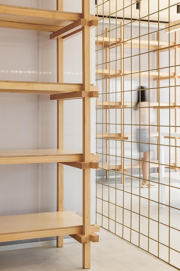 Interior Space divided with Golden Wire Meshes For Multiple Uses In This Store In Portugal by Stu.Dere- Sheet6