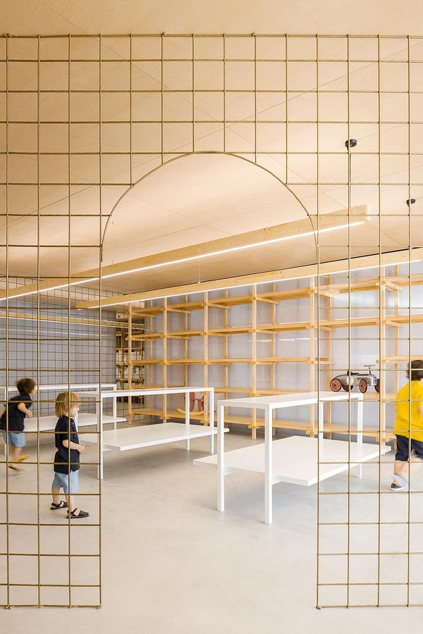 Interior Space divided with Golden Wire Meshes For Multiple Uses In This Store In Portugal by Stu.Dere- Sheet7