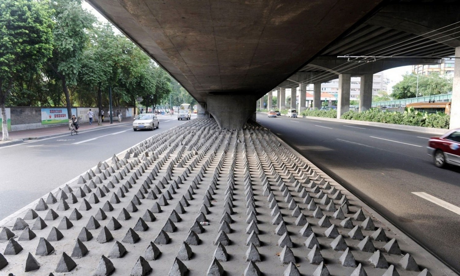 Hostile Architecture - Under-road spikes in Guangzhou, China- Sheet1