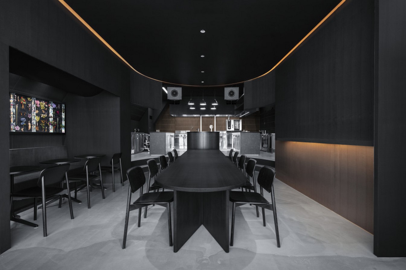 Snøhetta creates an informal, all black interior with amber accents for Burnside - Sheet5