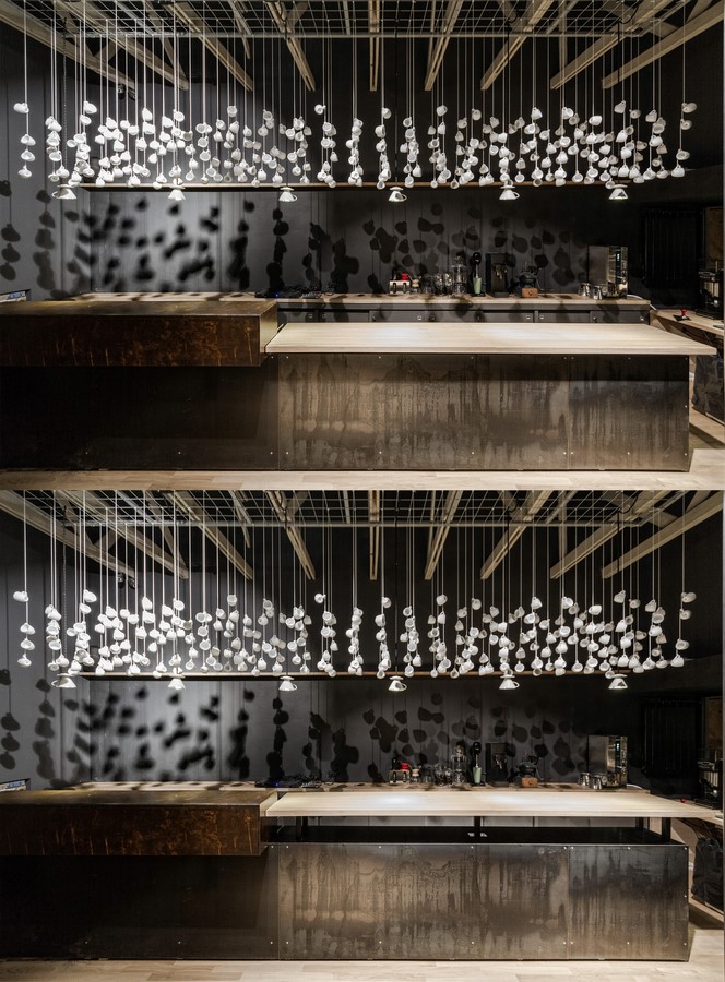 The cafe takes on a concentric form from the counter and bar seating. ©Yujie Liu