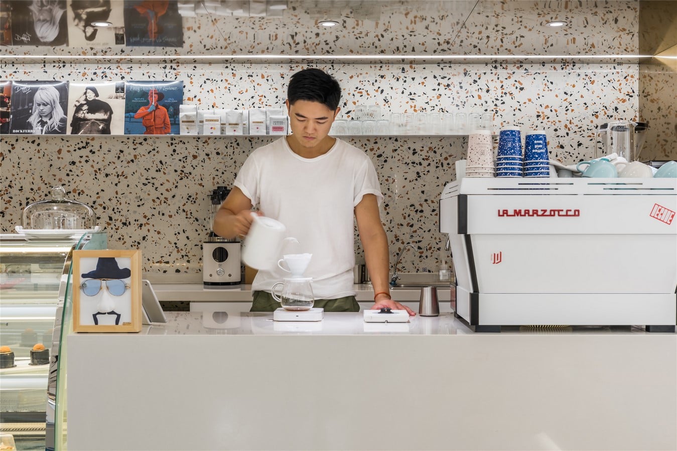 This Tiny Cafe is Dotted With White And Orange Interwoven Terrazzo Details In Tianjin is designed by TOUCH Design - Sheet2