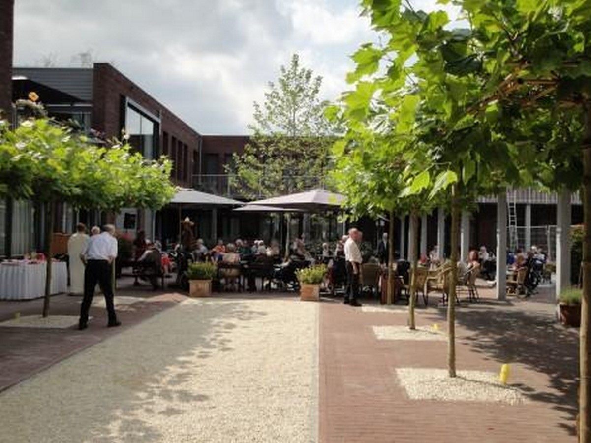 Design Squares and pathways that make them step outdoors_Photo credits dementiavillage.com