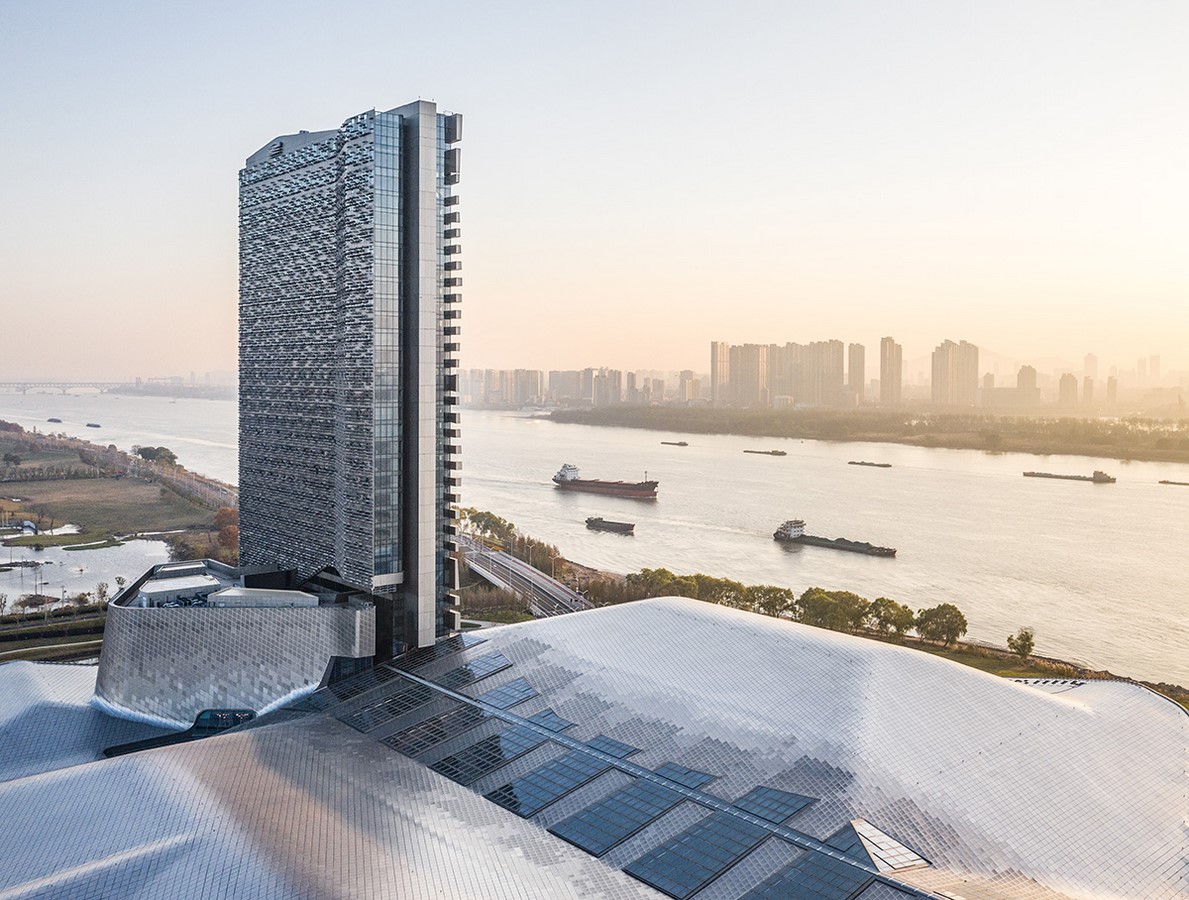 Titanium clad convention center alongside the Yangtze river completed by Morphosis  - Sheet1