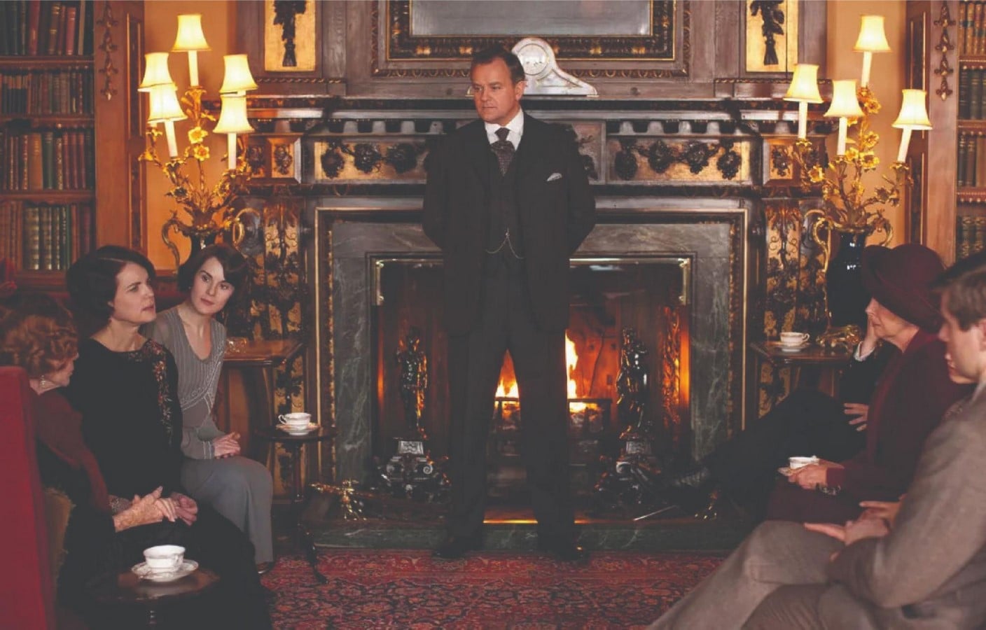 The Downton family gathered in the drawing room_©https://www.nytimes.com/2013/01/04/arts/television/downton-abbey-begins-third-season-on-sunday-on-pbs.html