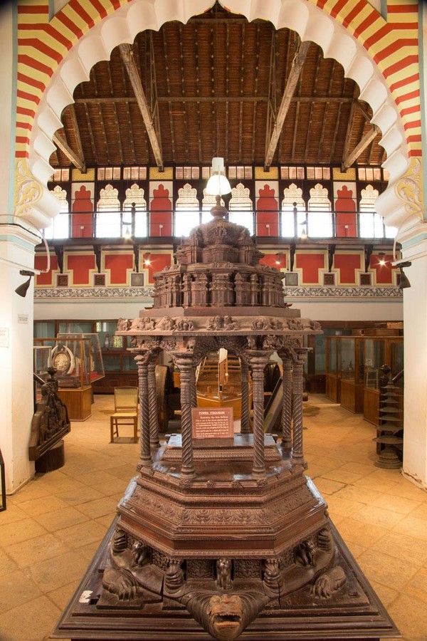 Wood carving of Pushpa Vimanam, one of the artifacts in the Napier museum_https://www.napiermuseum.org/artifacts/wood-carvings/wood-carvings-pushpa-vimanam/115