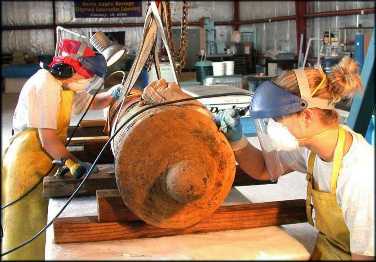 (Conservation team preserving a cannon in the QAR Laboratory.*)_https://ancientnc.web.unc.edu/exhibits/shipwrecks