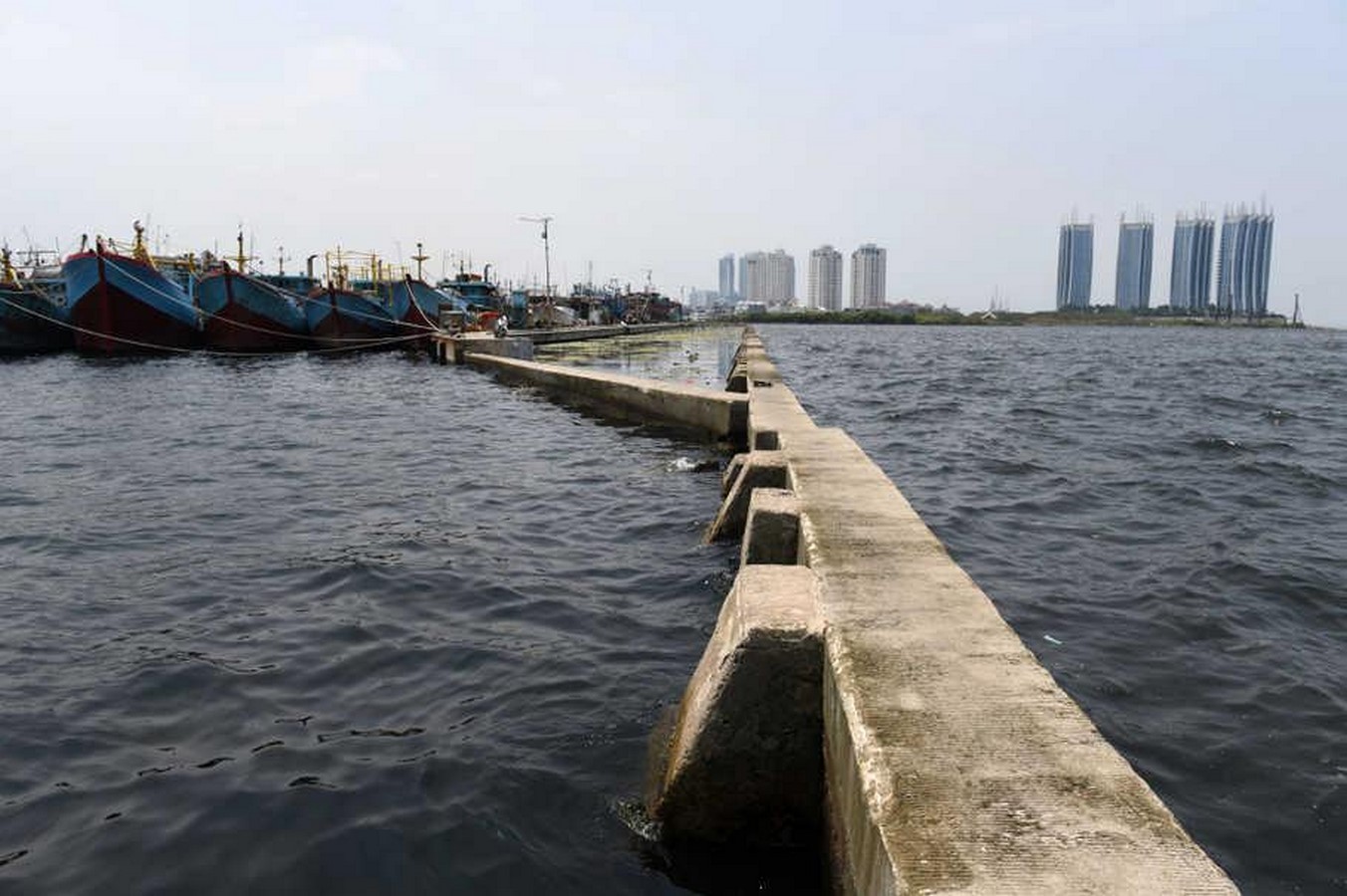 Jakarta's Race Against Time: Battling Sinking and Flooding Amid Global Warming - Sheet5