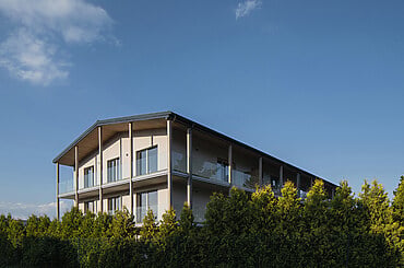 Apartment Building at the Foot of the Hill by Karnet architekti